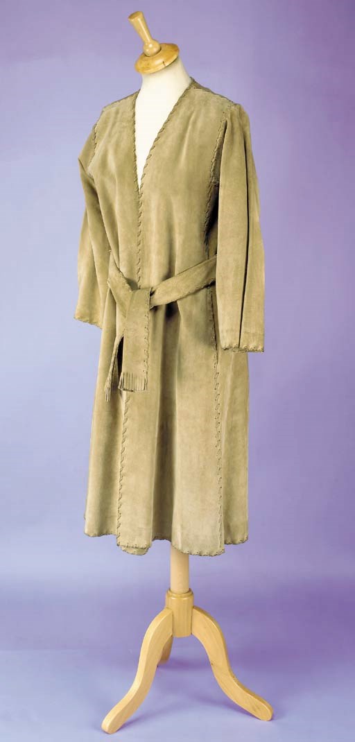 A coat of fawn suede, with suede stitch detailing and two matching belts, labelled YVES SAINT LAURENT PARIS and stamped 34853, 1970s