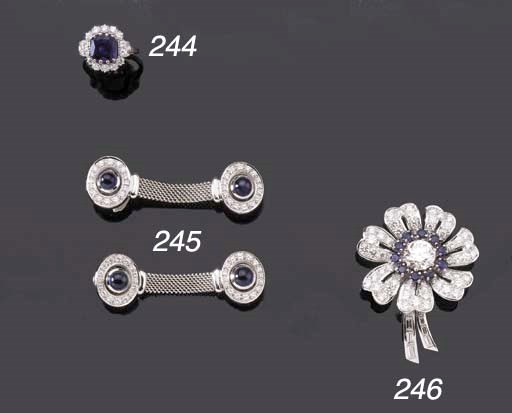 A WHITE GOLD SAPPHIRE AND DIAMOND CLUSTER RING