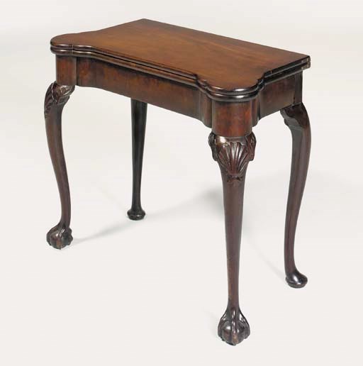 A GEORGE II MAHOGANY CONCERTINA-ACTION TEA-TABLE