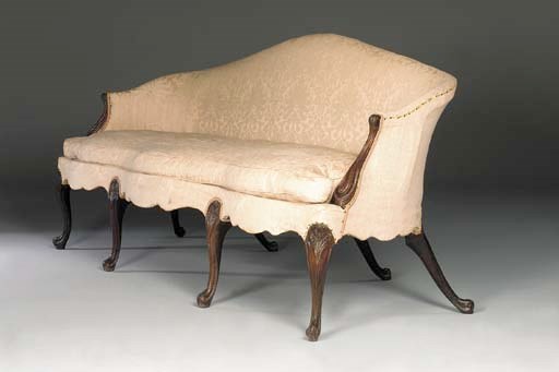 A GEORGE III MAHOGANY SERPENTINE SOFA