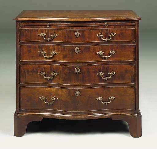 A GEORGE III MAHOGANY SERPENTINE CHEST
