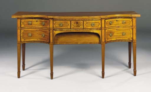 A GEORGE III MAHOGANY SERPENTINE SIDEBOARD