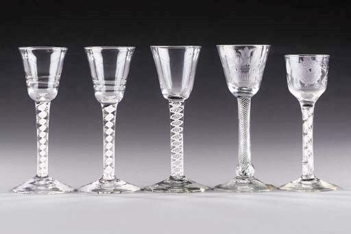 Two 'Lynn' opaque-twist wine-glasses and another; and two engraved air-twist wine-glasses