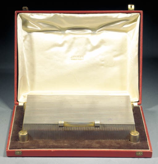 A Gustave Keller silvered metal and gilt cigarette box