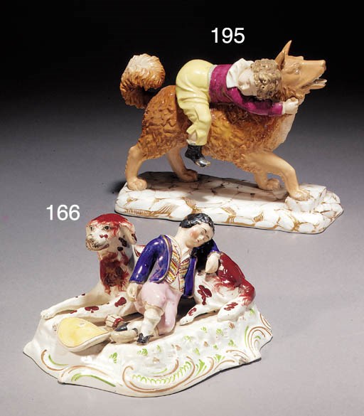 A porcelain group of a boy and hound