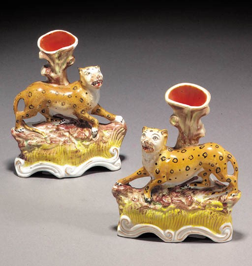 Two leopard spill vases