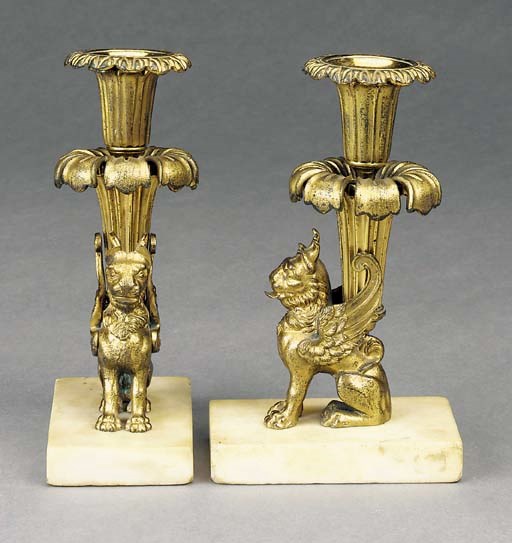 A PAIR OF REGENCY ORMOLU AND WHITE MARBLE CANDELSTICKS
