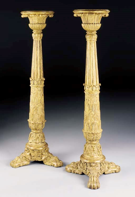A PAIR OF REGENCY GILTWOOD TORCHERES