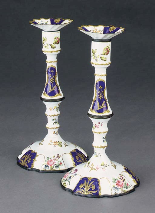 A PAIR OF POLYCHROME-DECORATED AND PARCEL-GILT ENAMEL CANDLESTICKS