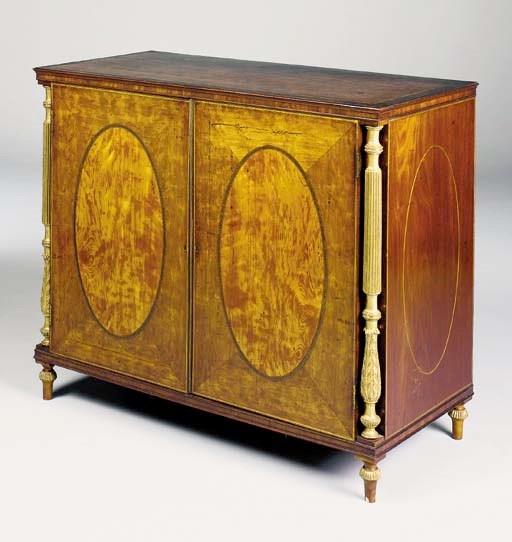 A GEORGE III MAHOGANY AND PARCEL-GILT SIDE CABINET