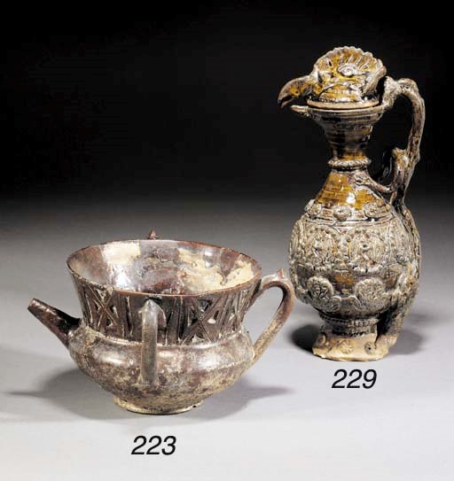 A Channakale brown glazed pottery ewer and cover
19th century