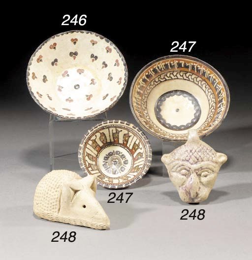 A Persian pottery pendant