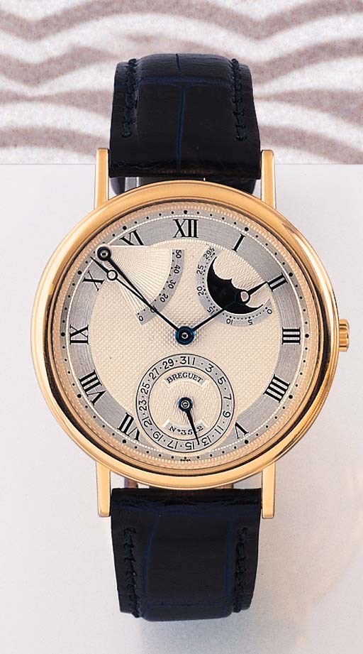 BREGUET. AN 18K GOLD SELF-WINDING WRISTWATCH WITH DATE, POWER RESERVE AND PHASES OF THE MOON