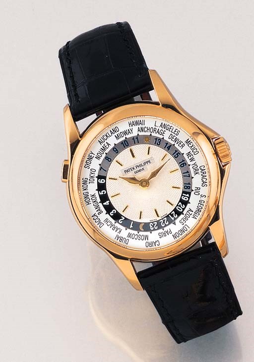 PATEK PHILIPPE. A FINE 18K GOLD SELF-WINDING WORLDTIME WRISTWATCH