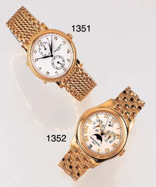 PATEK PHILIPPE. A FINE 18K GOLD SELF-WINDING ANNUAL CALENDAR WRISTWATCH WITH PHASES OF THE MOON, POWER RESERVE AND BRACELET