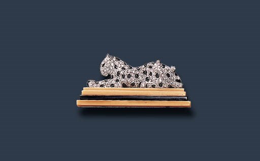 A RARE ART DECO AGATE, DIAMOND ONYX AND ENAMEL BROOCH, BY CARTIER