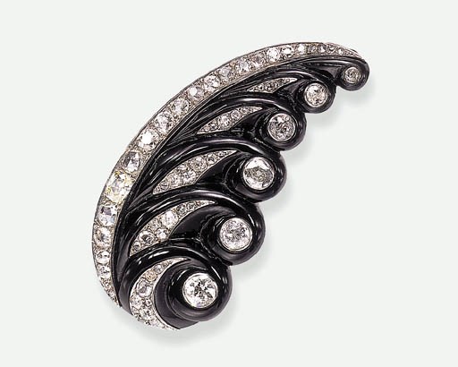 AN ONYX AND DIAMOND BROOCH, BY SUZANNE BELPERRON