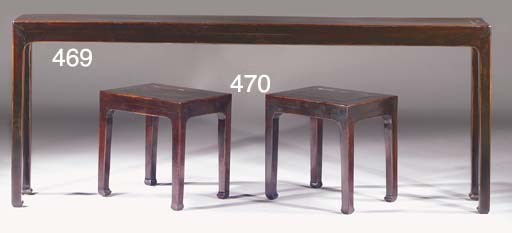 A narrow black lacquered side table