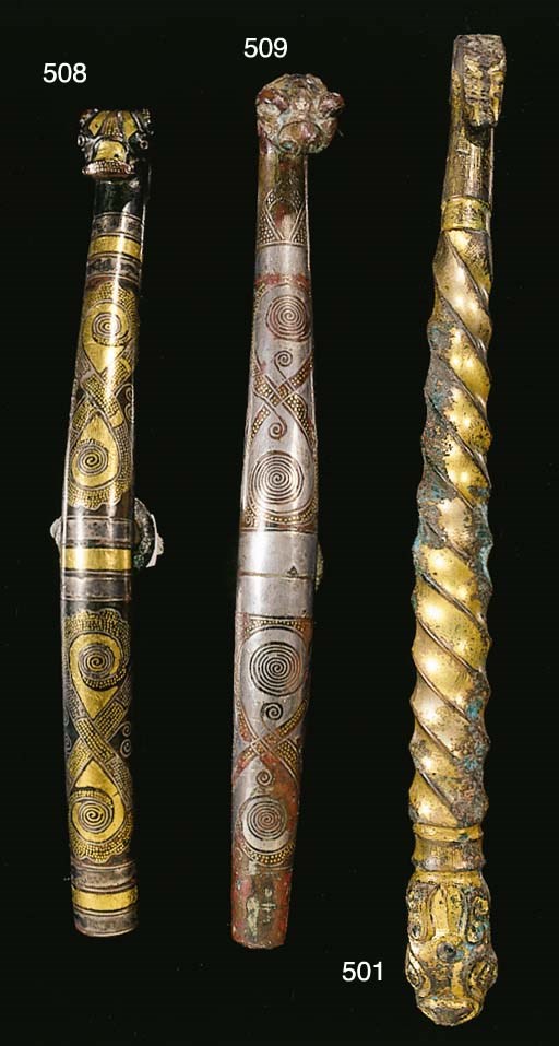 A silver and gold-inlaid bronze garment hook, Daigou