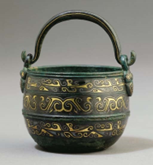 A rare gold and silver-inlaid small bronze bucket