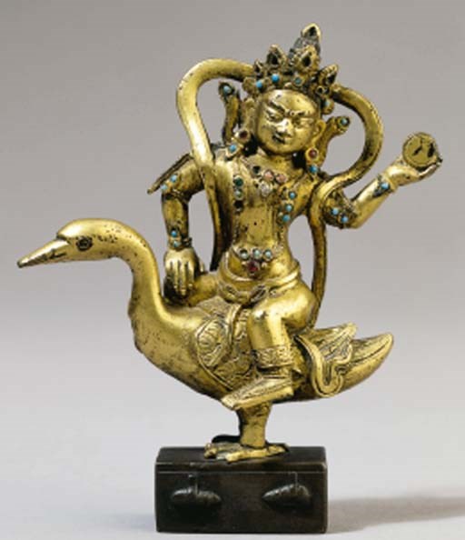 A Sino-Tibetan gilt-bronze figure of Manshuri on a moongoose