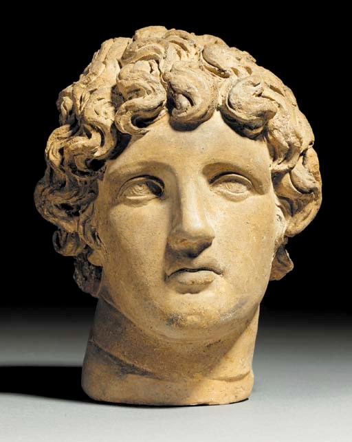 AN ETRUSCAN TERRACOTTA VOTIVE MALE HEAD