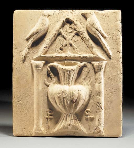 A BYZANTINE TERRACOTTA RELIEF TILE WITH BIRDS AND URN