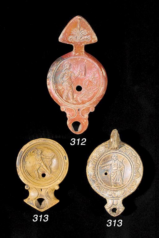 A ROMAN POTTERY 'GLADIATORS' LAMP