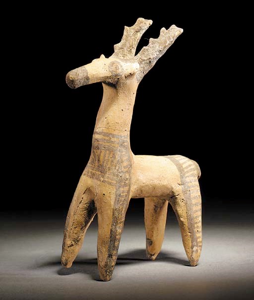 A RARE CYPRIOT WHITE PAINTED WARE FIGURE OF A DEER