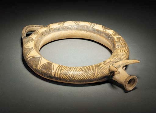 A CYPRIOT WHEELMADE WHITE PAINTED WARE ZOOMORPHIC-SPOUTED RING VESSEL