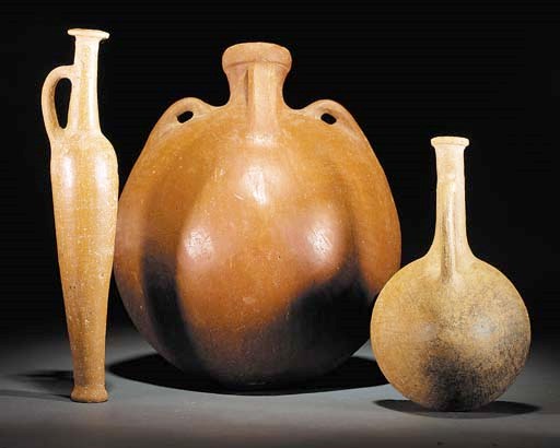 THREE CYPRIOT WHEELMADE RED LUSTROUS WARE FLASKS