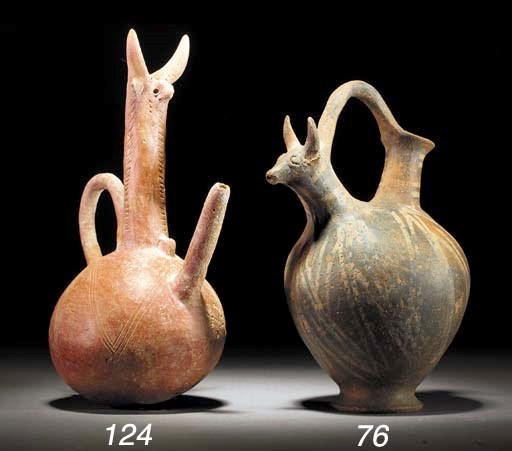 A CYPRIOT BASE RING WARE JUG WITH BUCRANIAL SIDE SPOUT
