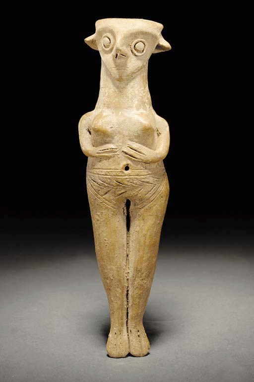 A CYPRIOT BASE RING WARE FEMALE FIGURE