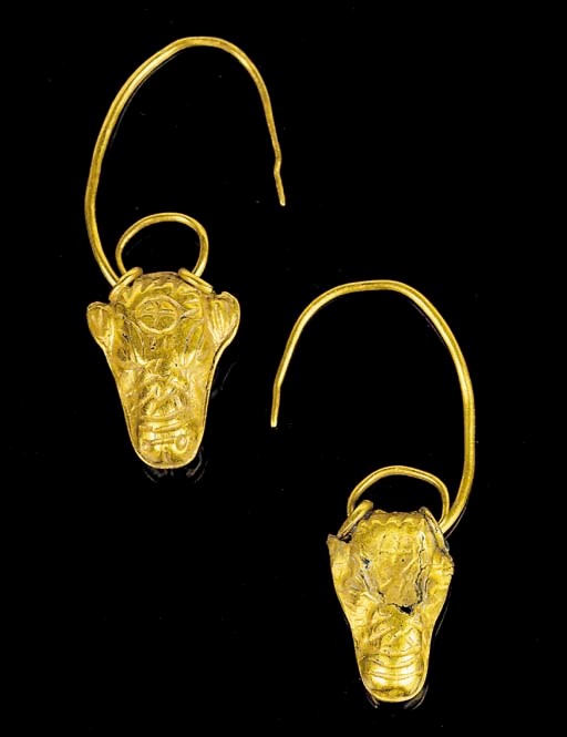 A PAIR OF CYPRIOT GOLD BULL'S HEAD EARRINGS
