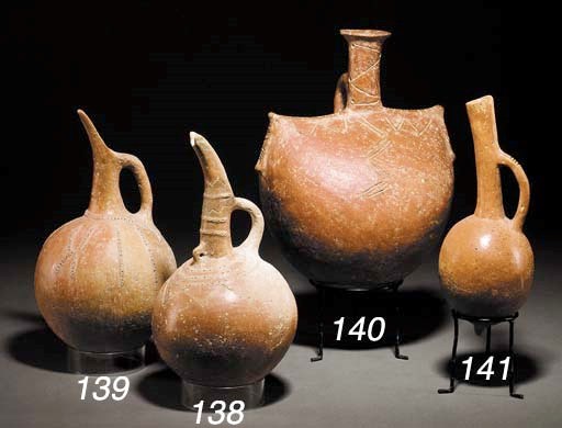 A CYPRIOT RELIEF-DECORATED RED POLISHED WARE JUG