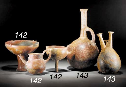 TWO CYPRIOT MOTTLED RED POLISHED WARE JUGS