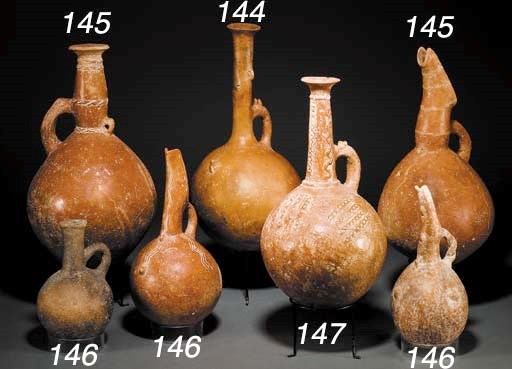 A CYPRIOT PLAIN RED POLISHED WARE JUG