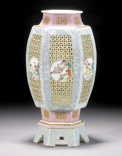 A famille rose reticulated hexagonal vase and shaped stand
19th century
