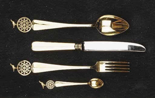 Twelve Dutch silver-gilt table forks, knives and spoons