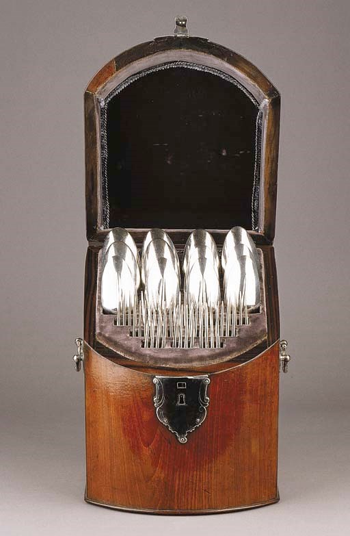 A Dutch mahogany veneered cutlery canteen with silver mounts and handles and twelve table forks and spoons