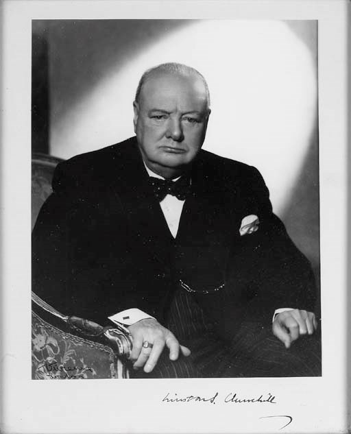 CHURCHILL, Sir Winston Spencer (1874-1965). Photograph signed on mount ('Winston S. Churchill'), studio portrait by Vivienne of London, showing Churchill half-length, seated in an armchair, signed on the image by the photographer, image 230 x 185mm, framed and glazed.