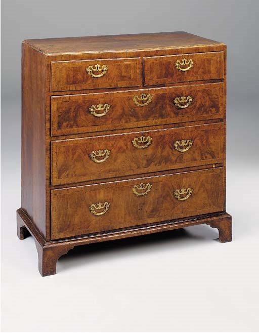 A GEORGE II WALNUT CROSSBANDED AND FEATHERSTRUNG CHEST