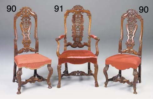 A SET OF FOUR CARVED WALNUT HIGHBACK DINING CHAIRS, EARLY 18TH CENTURY, in the manner of Daniel Marot
