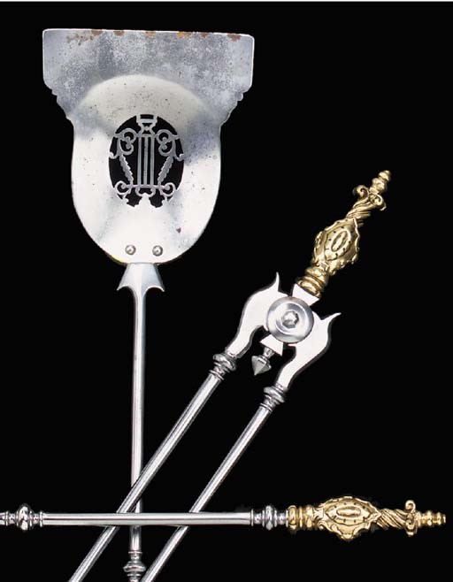 A set of three polished steel and brass fireirons, 19th century