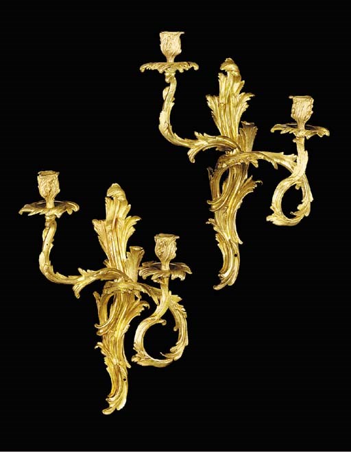 Two Louis XV style gilt bronze twin light wall appliques, early 20th century