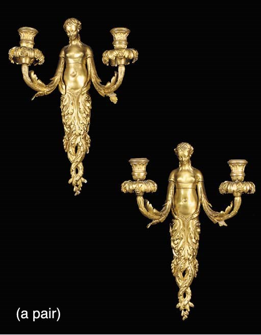 A pair of French gilt-bronze twin light wall appliques, first half 20th century