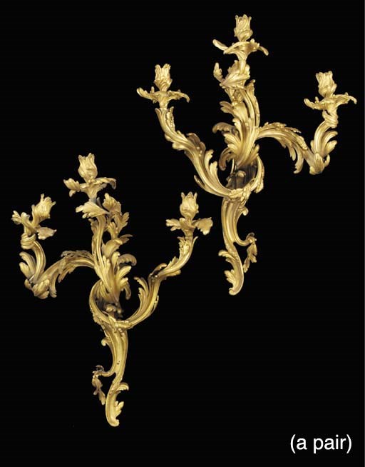 A pair of Louis XV style gilt bronze three light wall appliques, late 19th or early 20th century