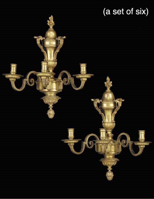 A set of six Regence style gilt-bronze three light wall appliques, first half 20th century