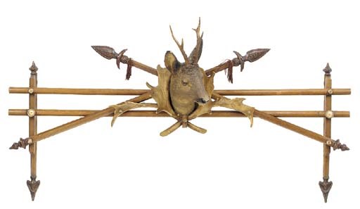A carved and painted composition and wood deers head overdoor cresting, early 20th century