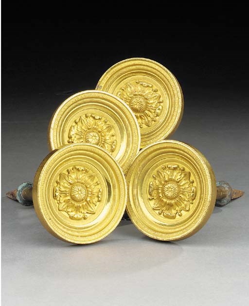 A set of four Empire style gilt bronze curtain tie backs, 19th century